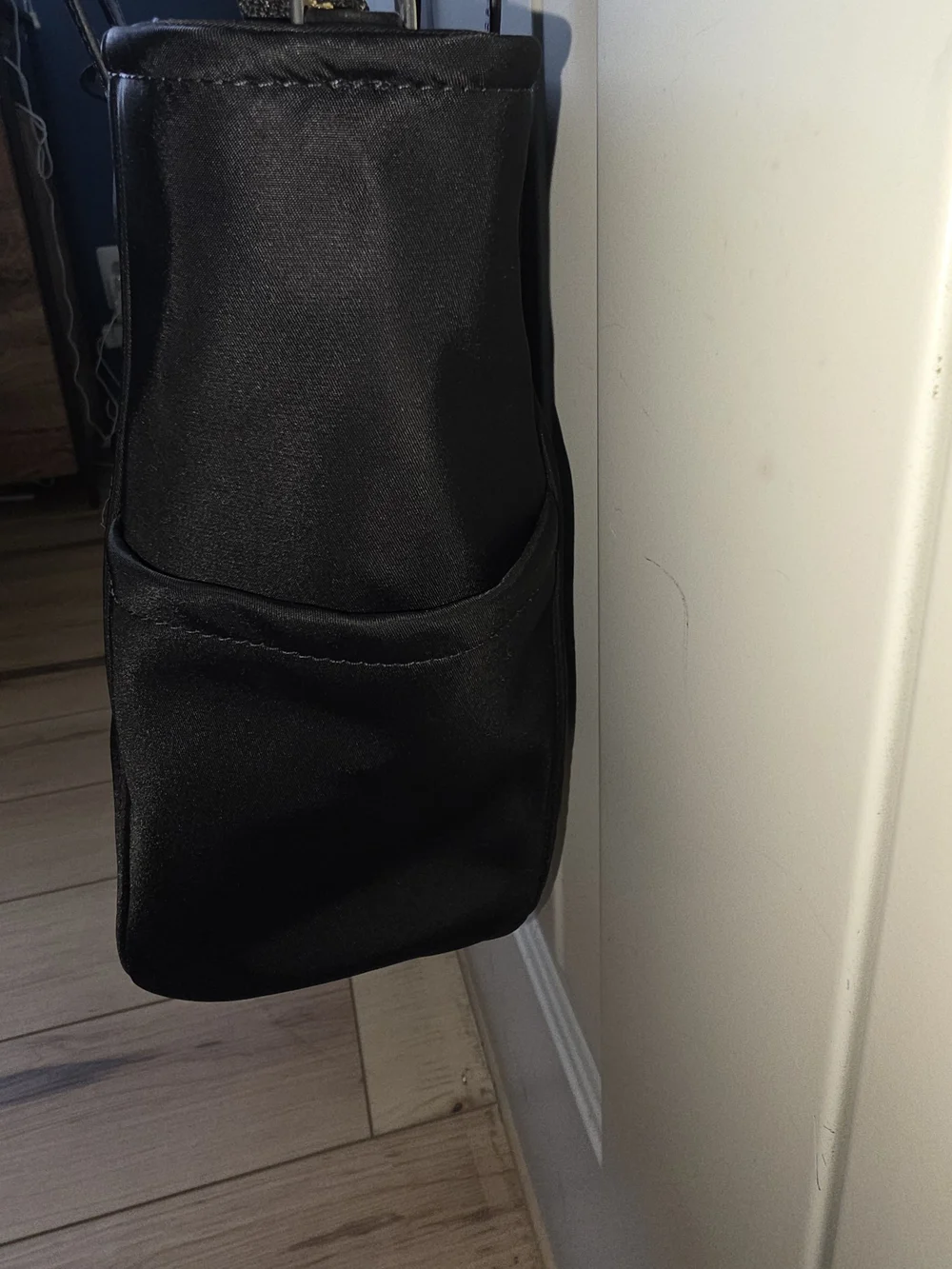 kate spade black tote with gold-tone logo and zipper